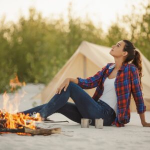 tourist-woman-in-the-camp-near-campfire.jpg